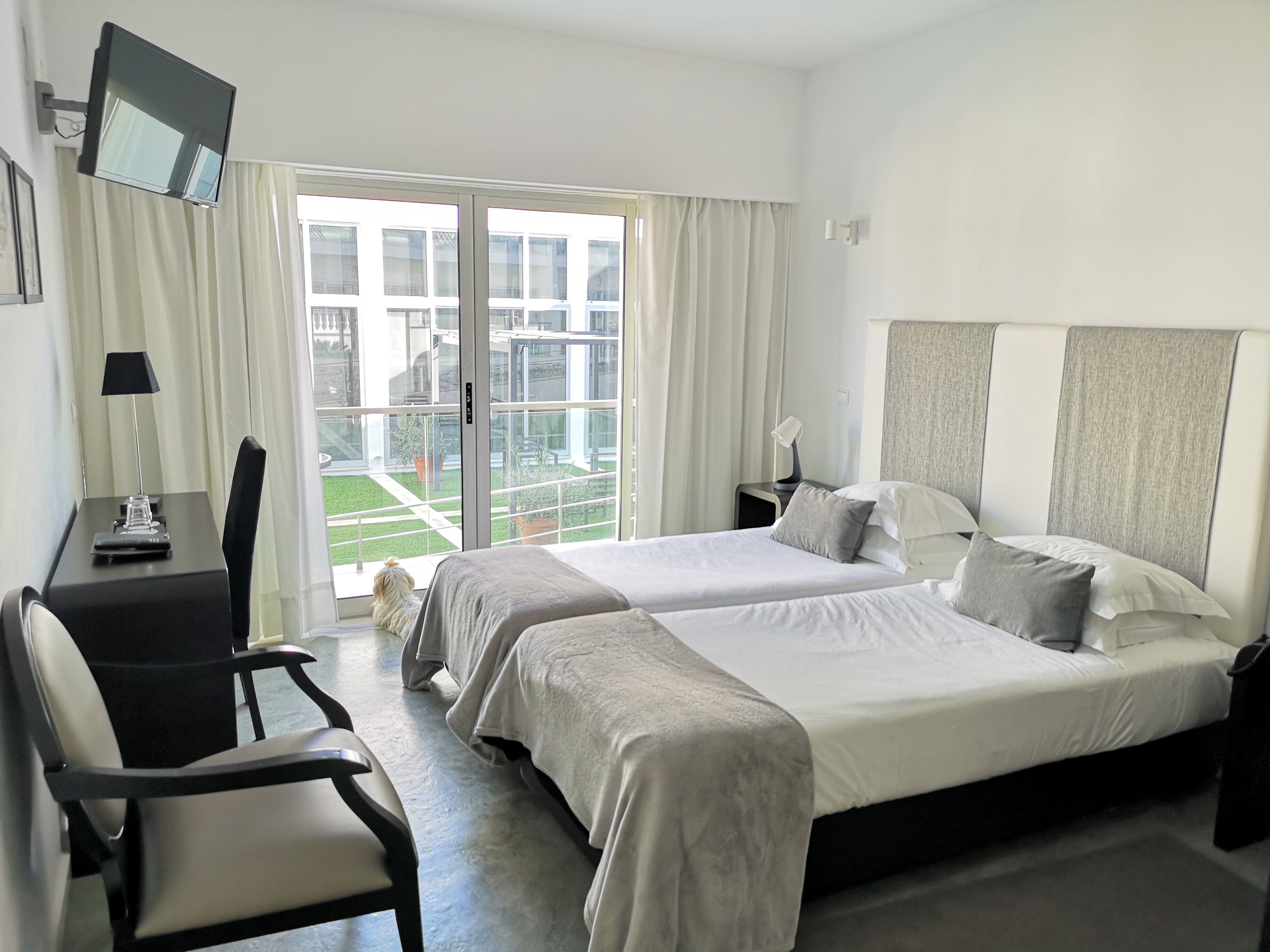 basic double or twin room, garden view | desk, laptop workspace, blackout curtains, free wifi