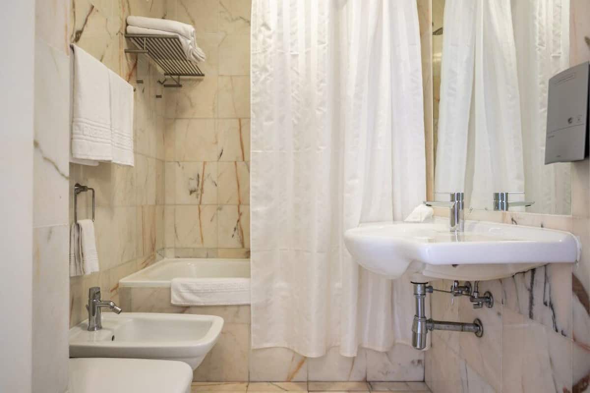 basic double or twin room, garden view | bathroom | hair dryer, bidet, towels