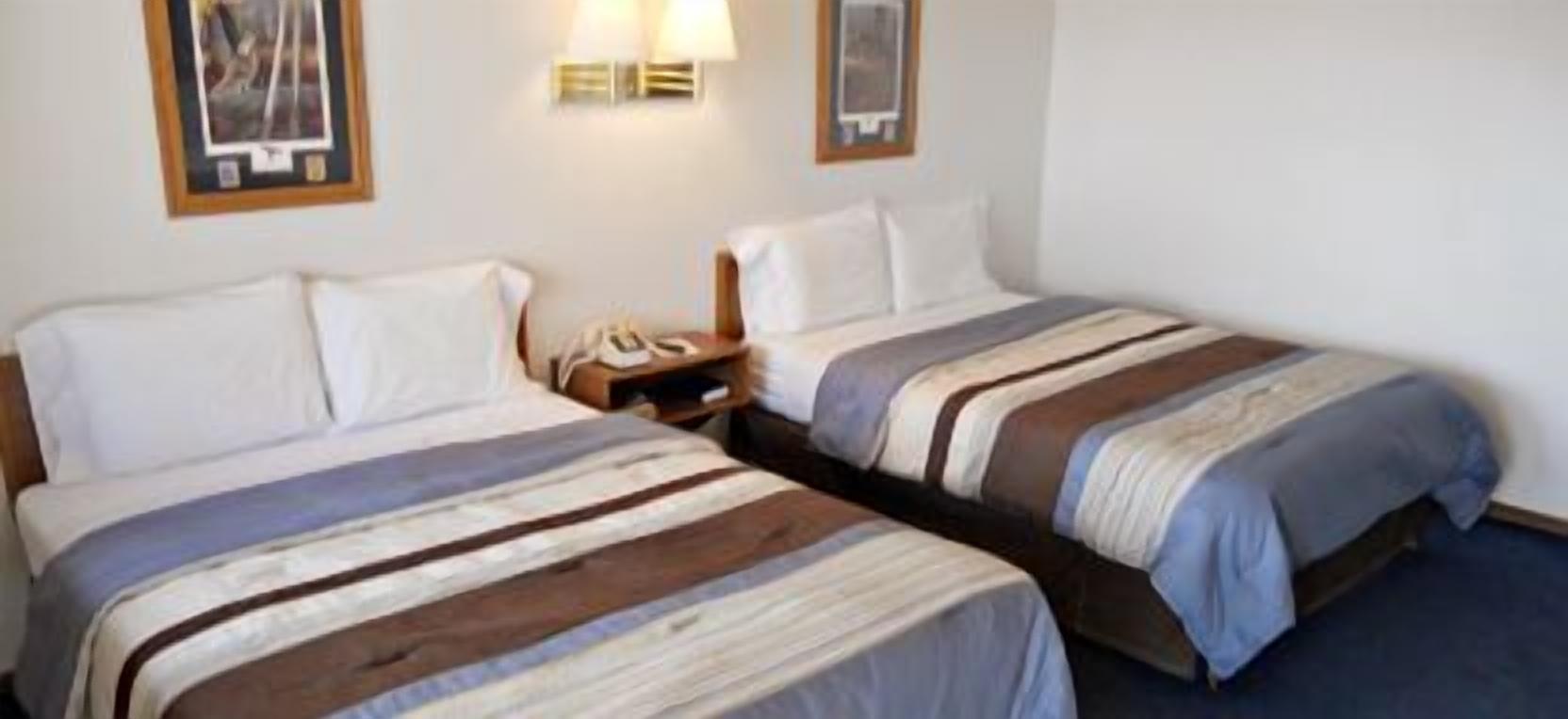 standard room, 2 queen beds | desk, blackout curtains, iron/ironing board, free wifi