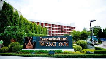 Welcome to the Wang Inn, where a beautifully manicured entrance sets the tone for a warm stay.