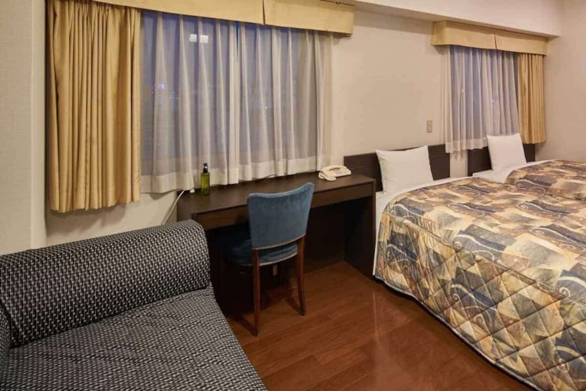 Premium bedding, desk, laptop workspace, free WiFi