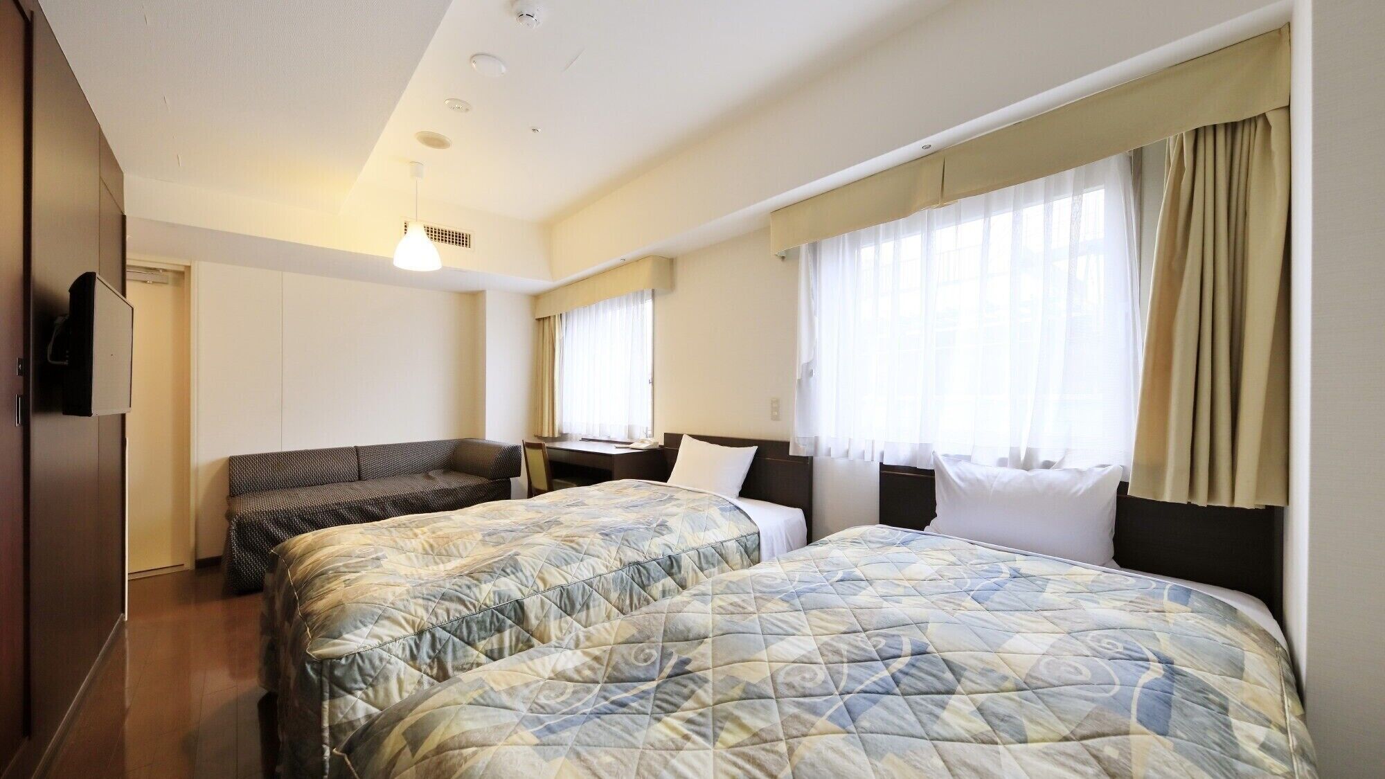 Premium bedding, desk, laptop workspace, free WiFi