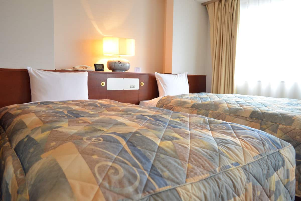 Premium bedding, desk, laptop workspace, free WiFi
