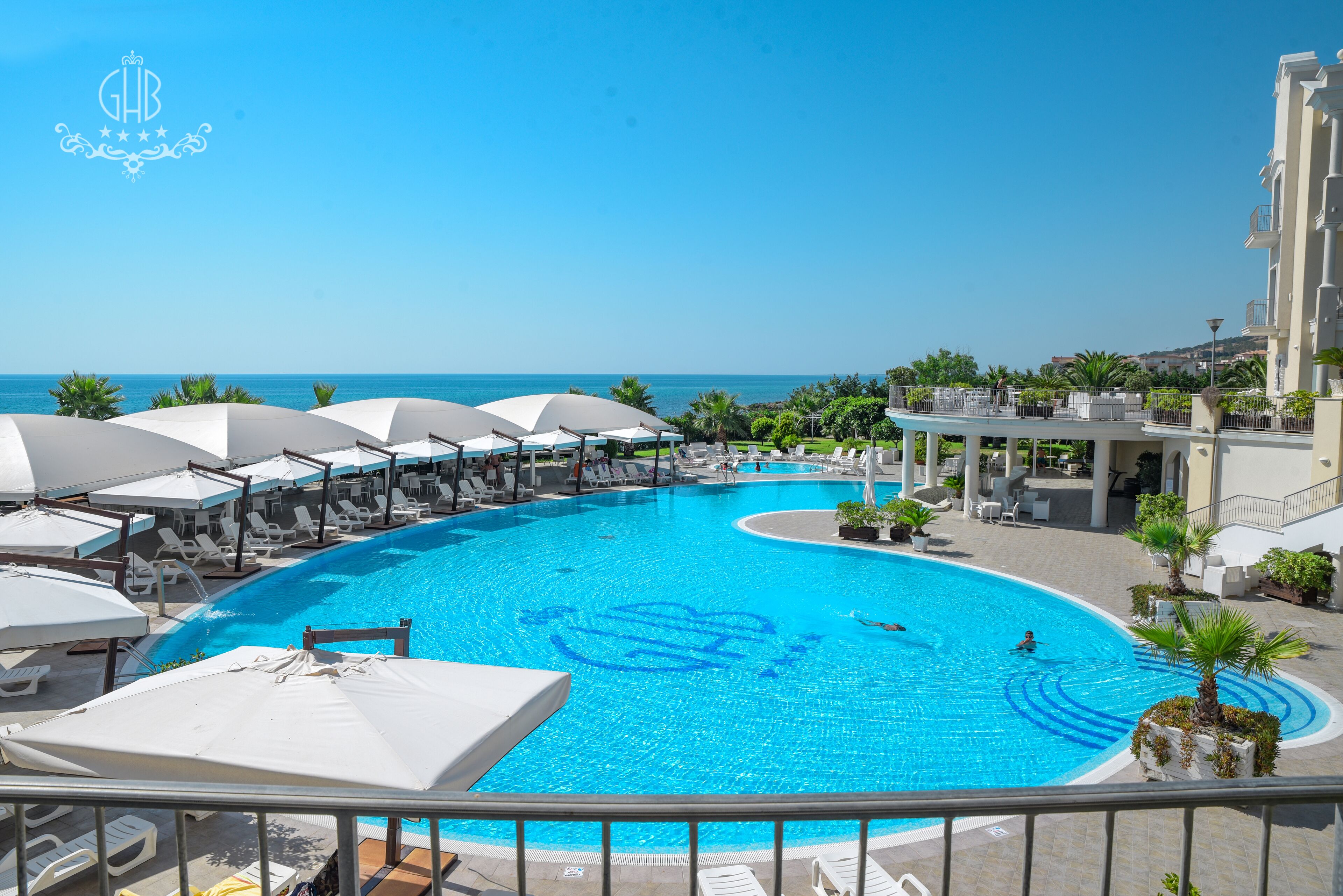 outdoor pool, pool umbrellas, pool loungers