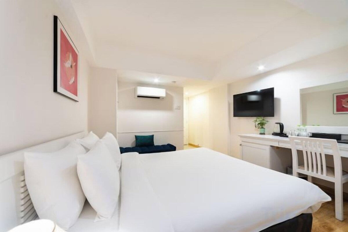 Premium bedding, minibar, desk, laptop workspace