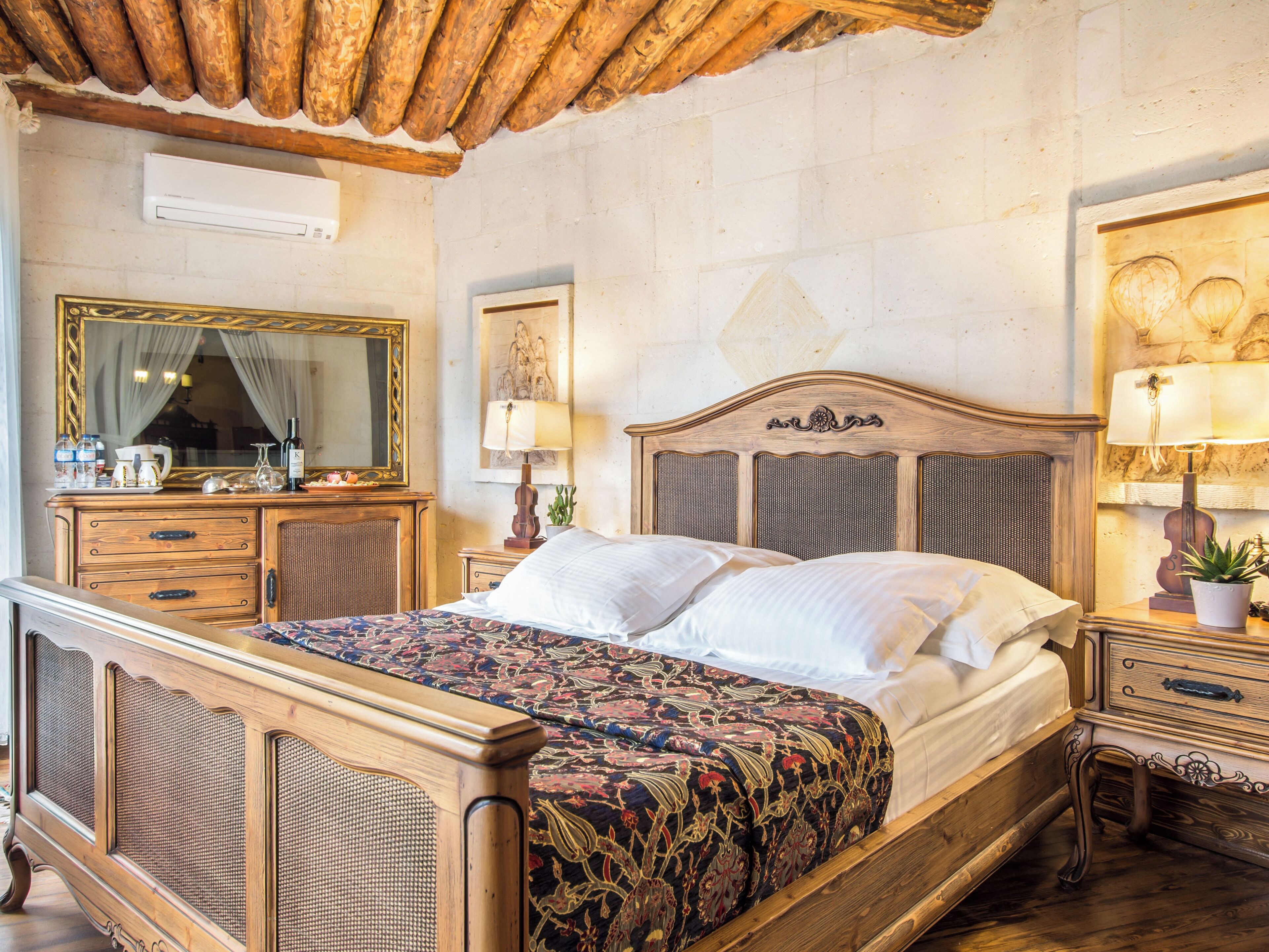 Deluxe Stone Suite | Minibar, in-room safe, individually decorated, individually furnished