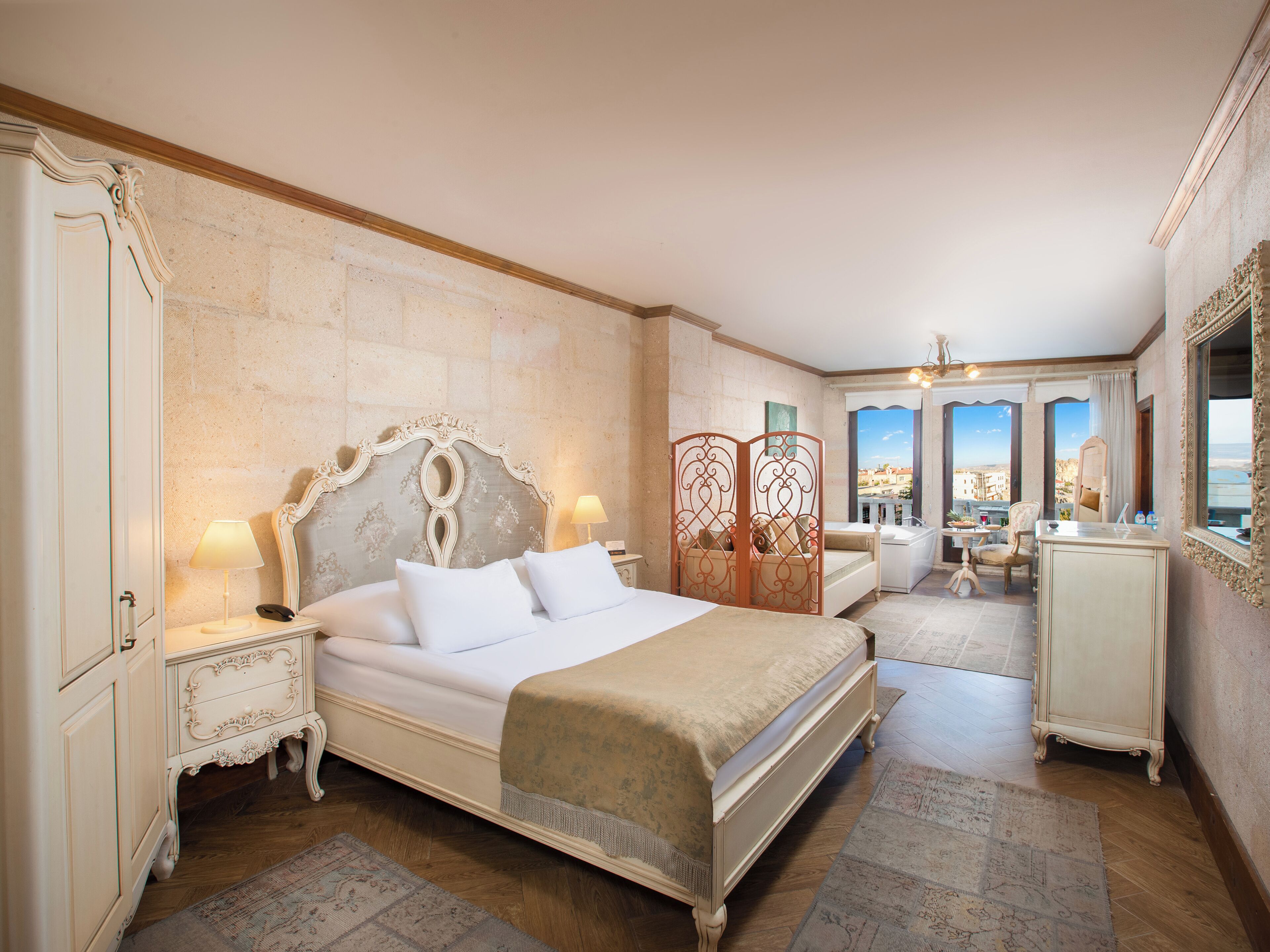 King Stone Suite | Minibar, in-room safe, individually decorated, individually furnished