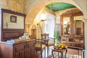 Deluxe Stone Room | Minibar, in-room safe, individually decorated, individually furnished