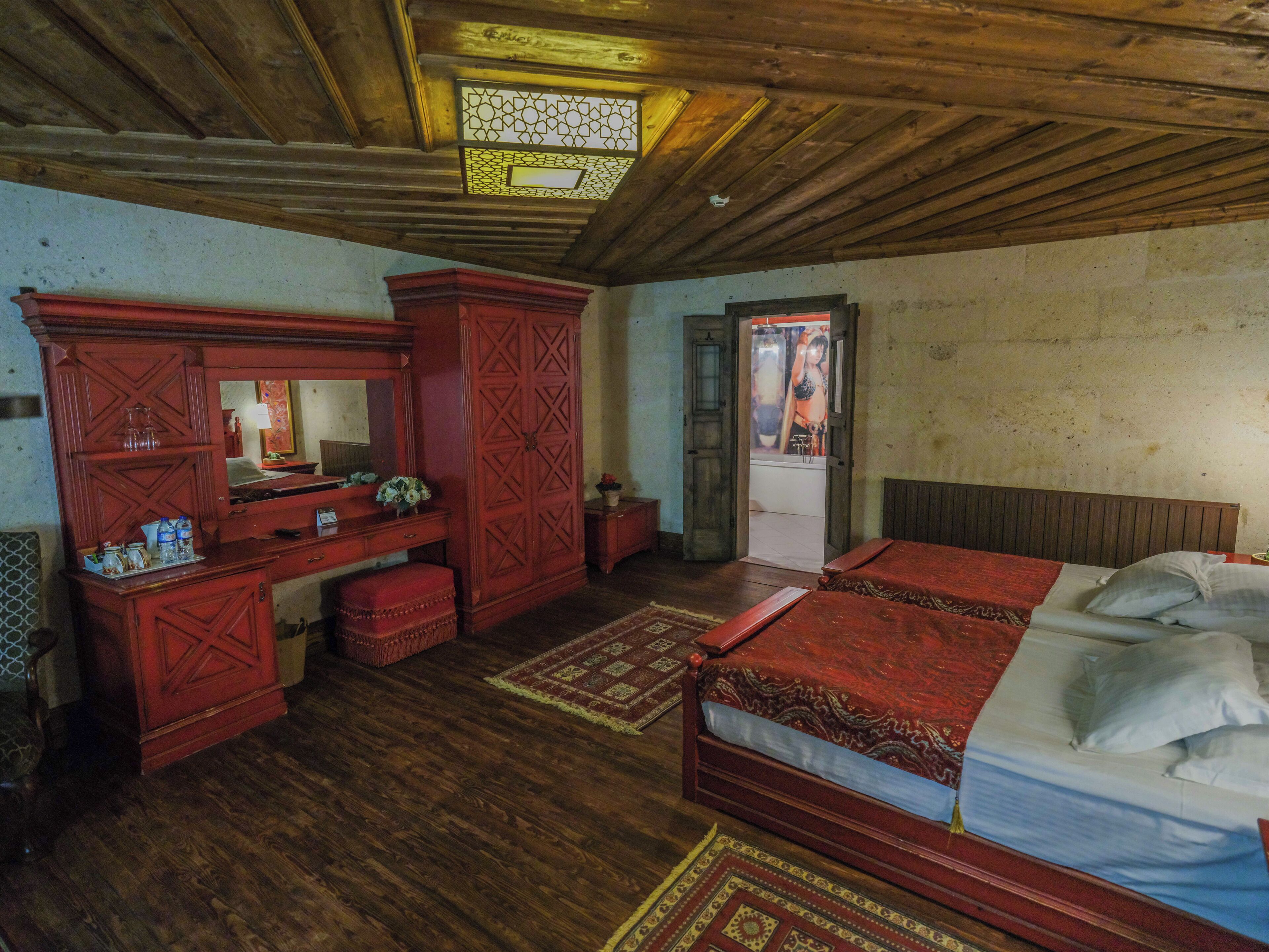 Deluxe Stone Room | Minibar, in-room safe, individually decorated, individually furnished