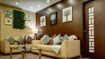 Presidential Studio Suite | Living area | Flat-screen TV
