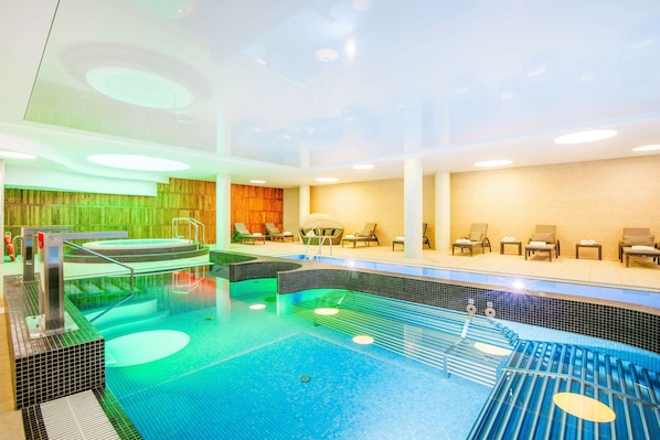 Indoor pool, open 6:00 AM to 10:00 PM, pool loungers, lifeguards on site