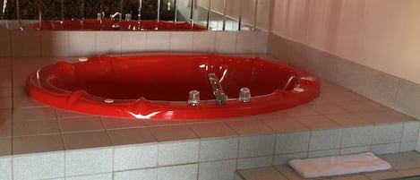 Deluxe Room, 1 King Bed, Smoking (Whirlpool Tub) | Jetted bathtub
