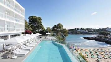 2 outdoor pools, pool umbrellas, pool loungers