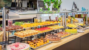 A buffet with various desserts and cakes, including chocolate, fruit, and cheesecake. - Aminess Vival Casa Velaris  (Supetar)
