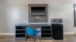 A modern room with a built-in TV, a microwave, and a compact refrigerator. - Motel 6 Stockbridge, GA – Hwy 138 W (Stockbridge)
