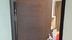 A closed wooden door with a number plate '204' and a keyhole. - The Rama Residence Chiang Rai (Chiang Rai)