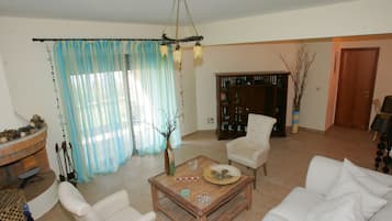 Villa, Terrace, Sea View | Living room | Flat-screen TV, fireplace