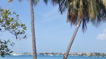 Beach nearby, white sand, beach towels