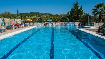 Outdoor pool, open 9 AM to 9 PM, pool umbrellas, pool loungers