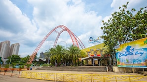 A roller coaster, a large billboard, and a building with a sign. - Holiday Inn Express Jakarta International Expo by IHG (Jakarta)