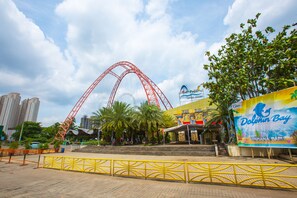 A roller coaster, a large billboard, and a building with a sign. - Holiday Inn Express Jakarta International Expo by IHG (Jakarta)