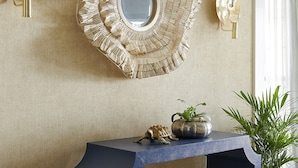 A room with a decorative mirror, a console table, and a potted plant. - The Christopher, The Edgartown Collection (Edgartown)