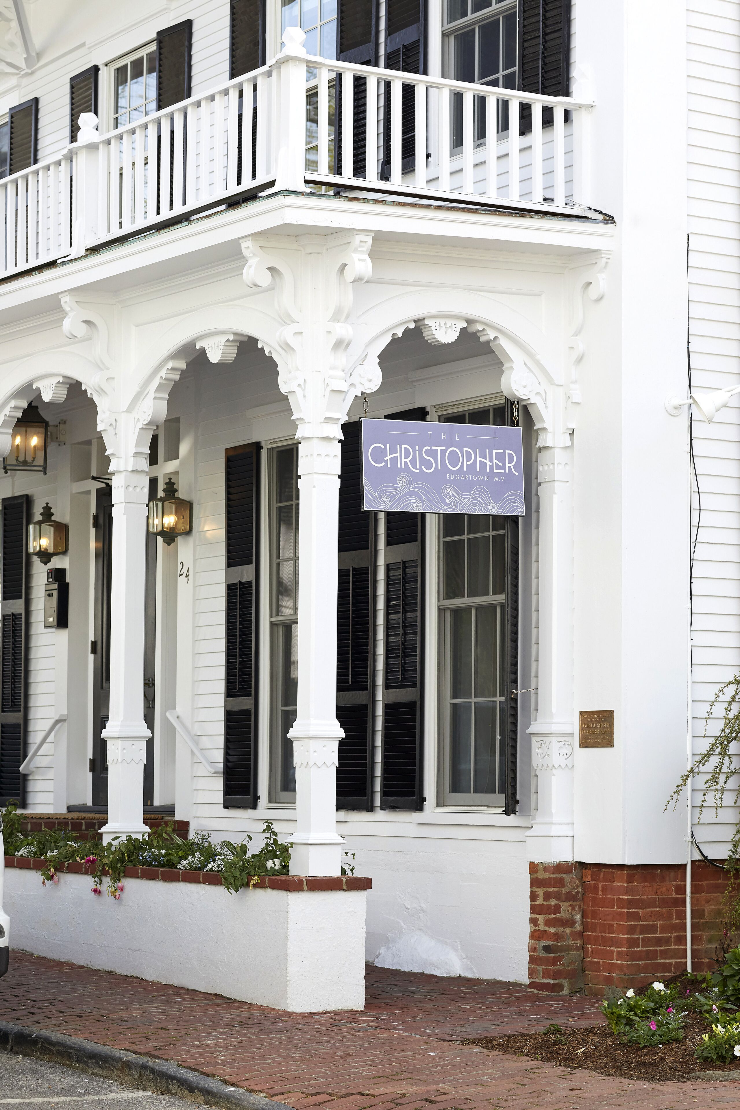 A white building with a sign reading "The Christopher Edgartown."