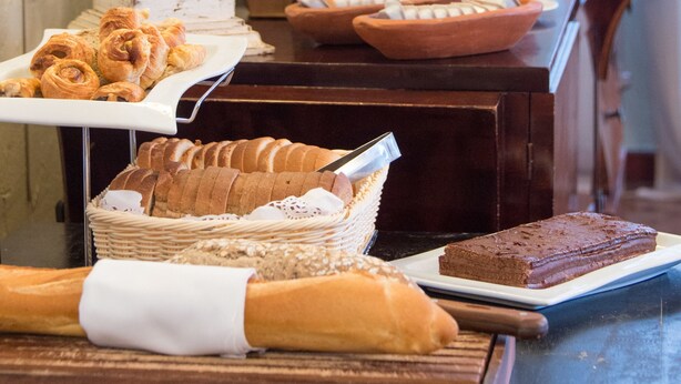 A buffet with various food items including pastries, bread, and desserts. - Hotel L'Imperatrice (Fort-de-France)