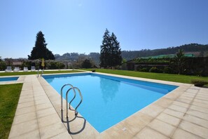 Seasonal outdoor pool, pool umbrellas, pool loungers