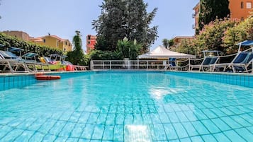 Outdoor pool, open 8:30 AM to 7:30 PM, pool umbrellas, pool loungers