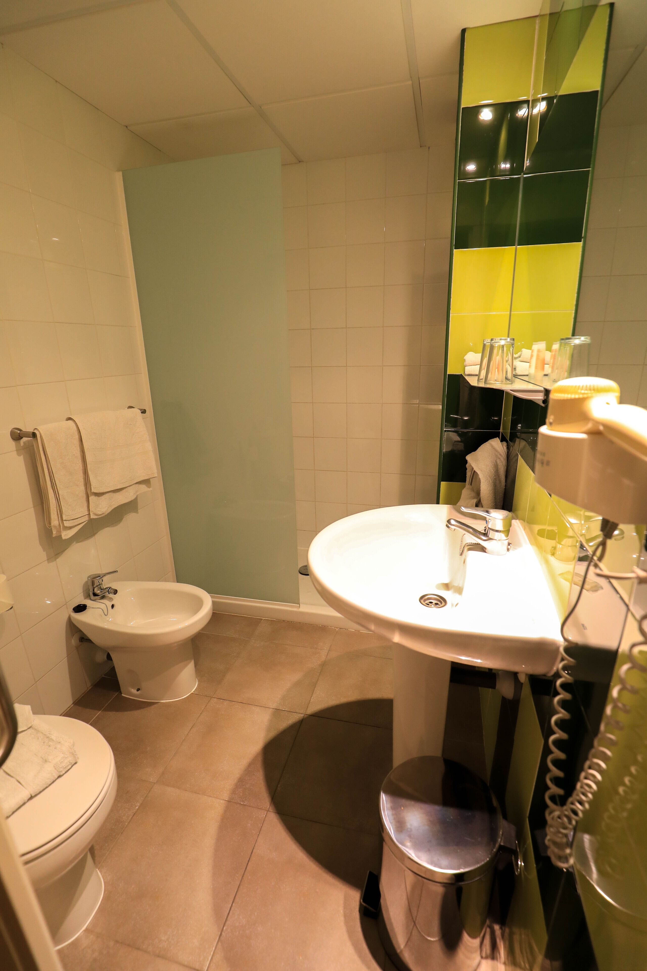 free toiletries, hair dryer, bidet, towels