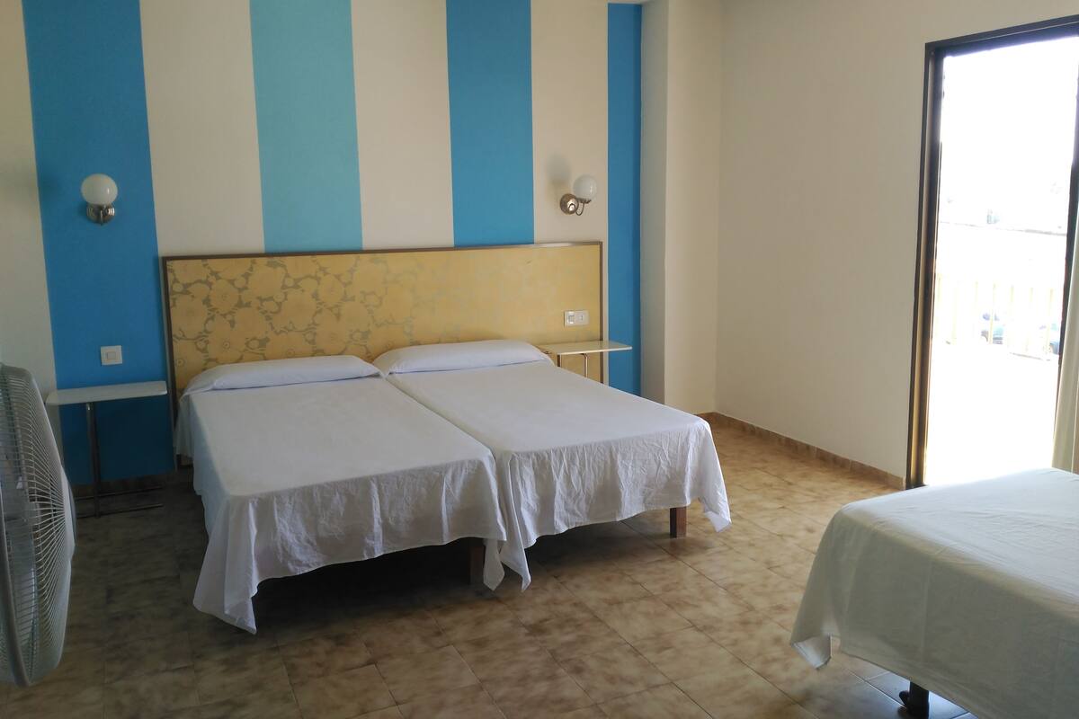 Triple Room, Balcony | Desk, cots/infant beds, individually decorated, bed sheets