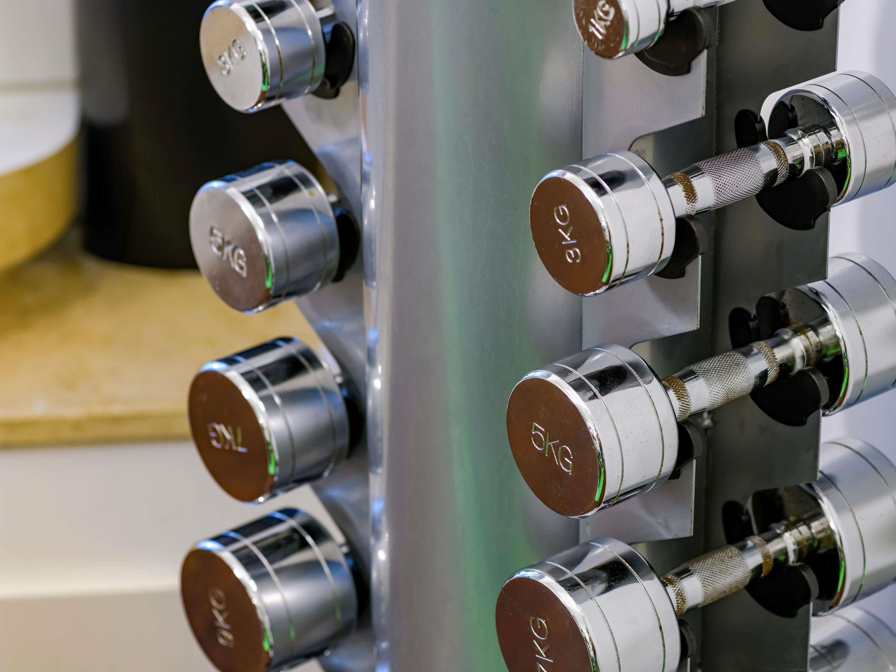 A close-up of a metallic structure with multiple cylindrical components, each marked with "KG" and a green indicator.