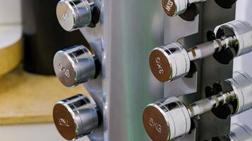 A close-up of a metallic structure with multiple cylindrical components, each marked with "KG" and a green indicator.