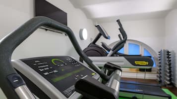 A gym with treadmills and exercise equipment.