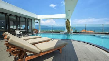 Outdoor pool, open 6:00 AM to 10:00 PM, pool umbrellas, sun loungers