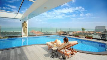 Outdoor pool, open 6:00 AM to 10:00 AM, pool umbrellas, pool loungers