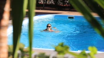 Outdoor pool, open 2:00 PM to 8:00 PM, pool loungers