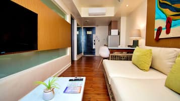 Suite, 1 Bedroom (Bed type subject to availability) | Living area | Flat-screen TV, DVD player