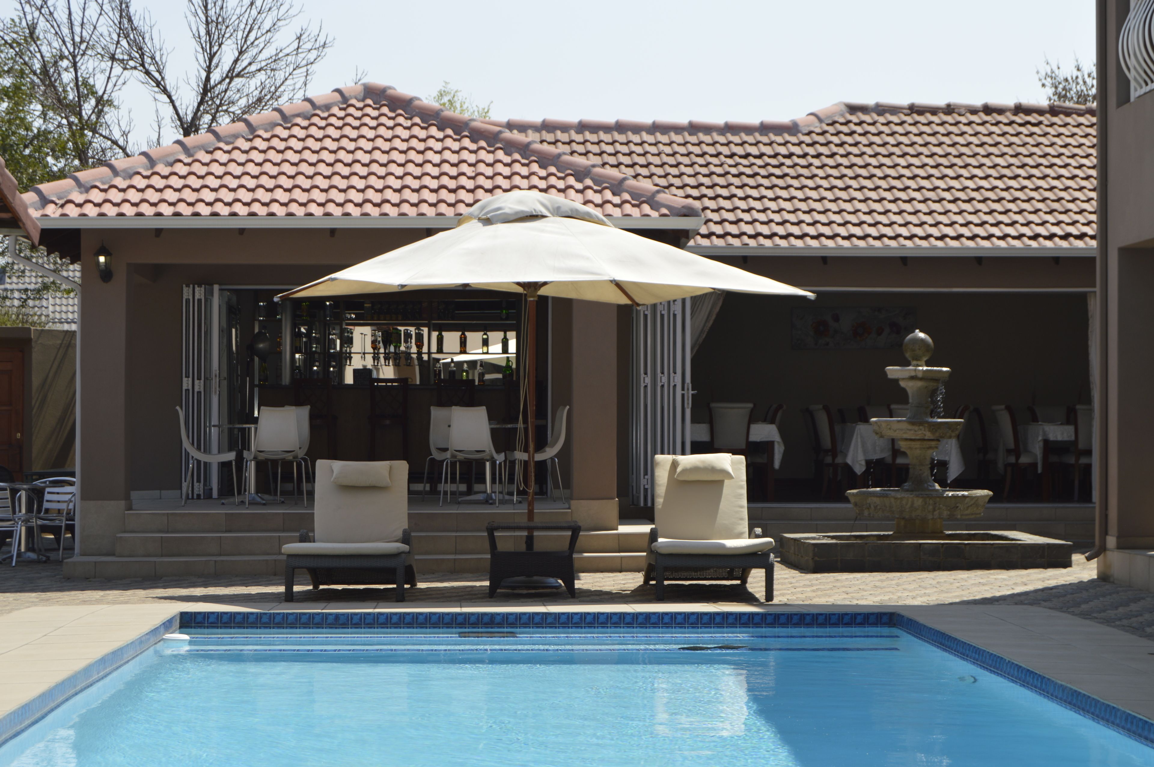 outdoor pool, pool umbrellas, pool loungers