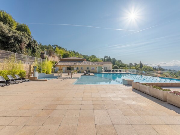 2 outdoor pools, open 9:00 AM to 7:00 PM, pool umbrellas, pool loungers