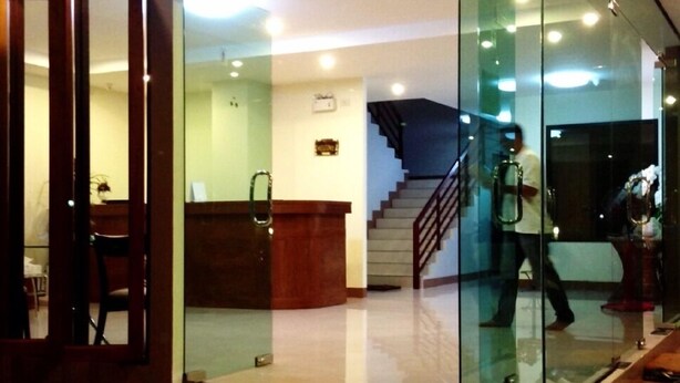 A modern lobby with a glass partition, a reception desk, and a staircase leading to an upper floor. - Chiang Mai P Place - Adults Only (Chiang Mai)