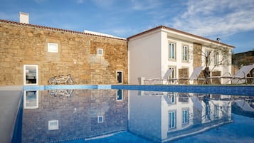 Seasonal outdoor pool, open 9:00 AM to 8:00 PM, pool umbrellas