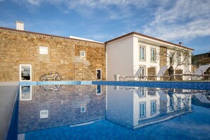 Seasonal outdoor pool, open 9:00 AM to 8:00 PM, pool umbrellas