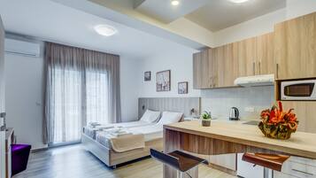 Deluxe Apartment, 1 Bedroom, Terrace, City View | In-room safe, desk, soundproofing, iron/ironing board