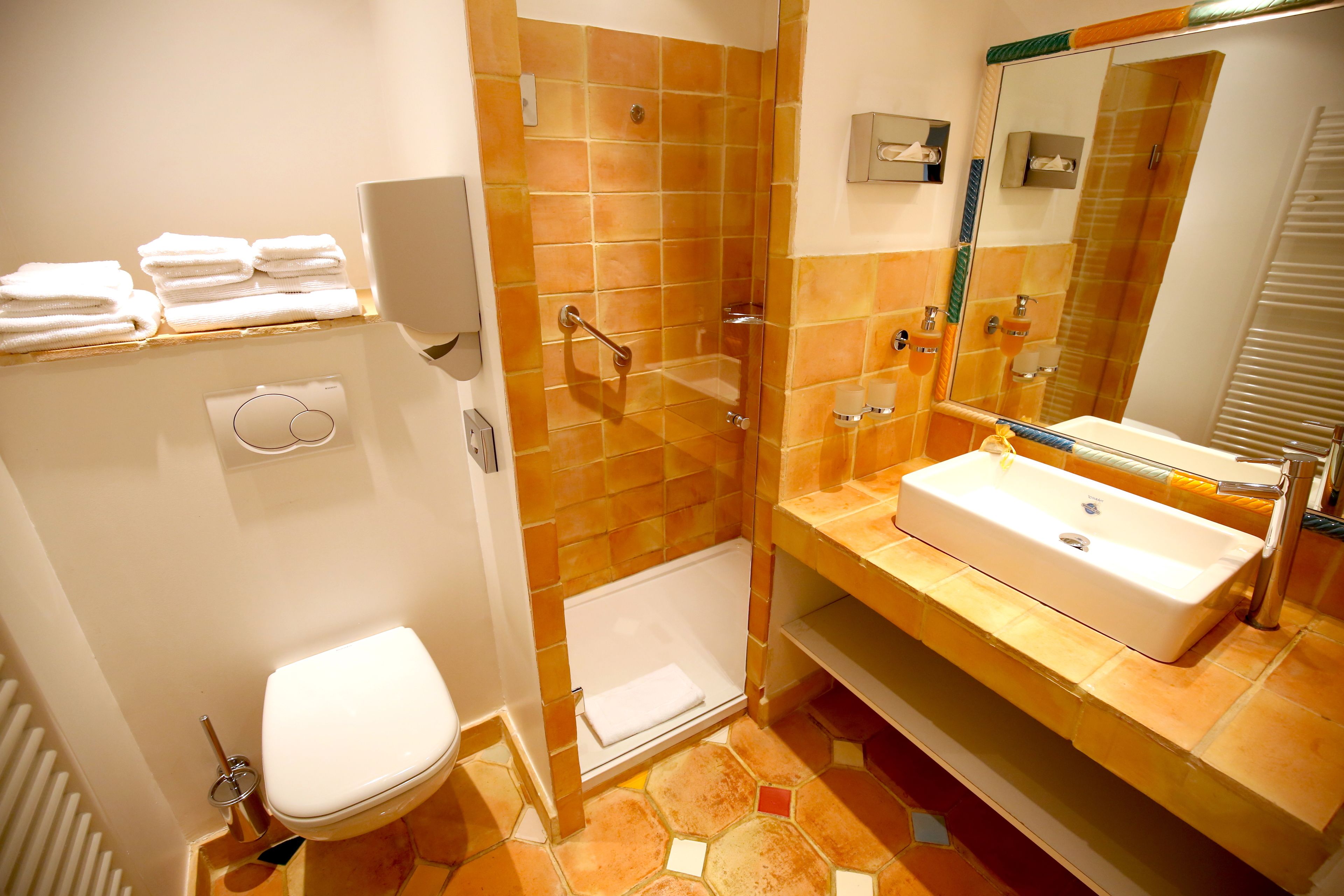 shower, designer toiletries, hair dryer, towels