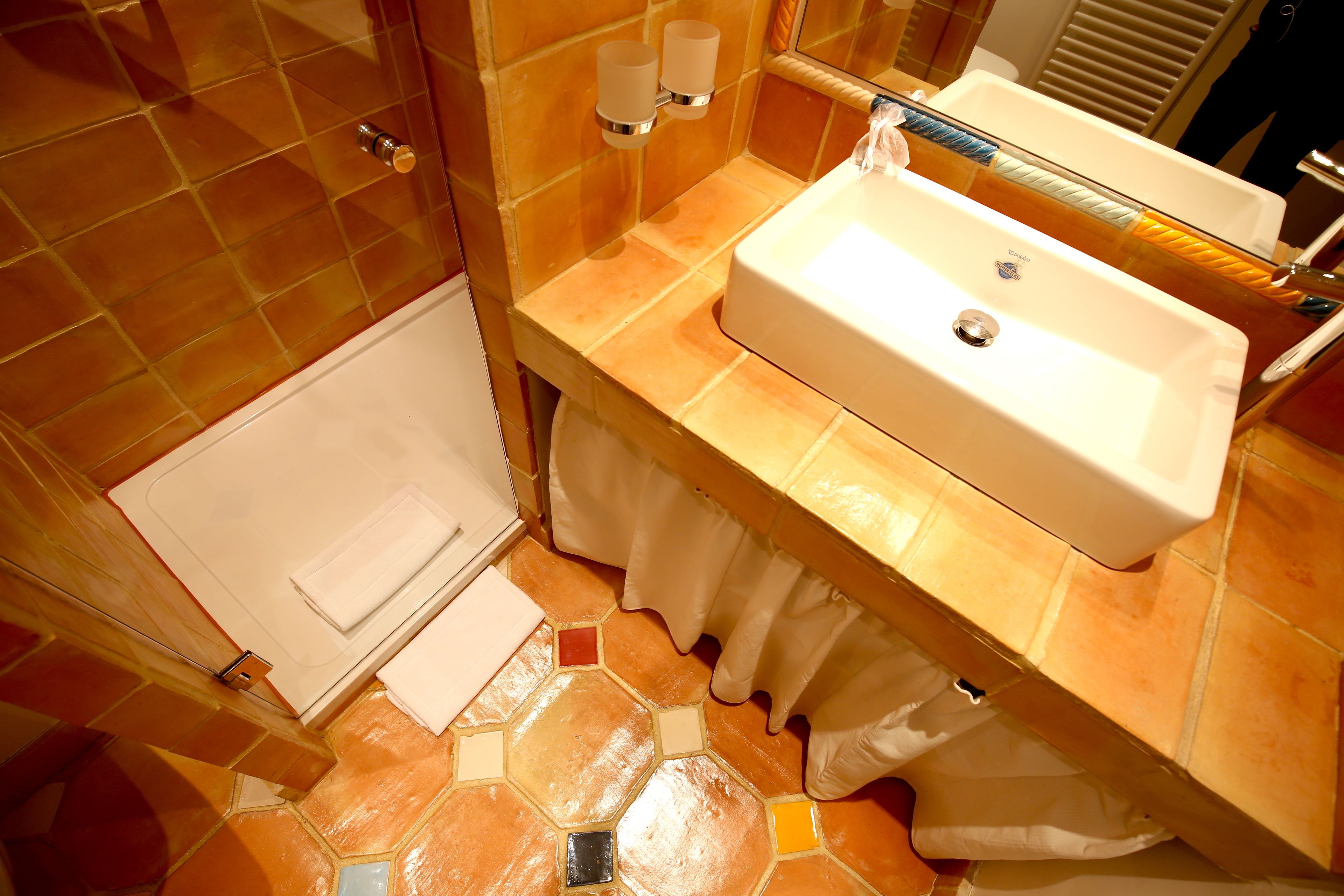 shower, designer toiletries, hair dryer, towels