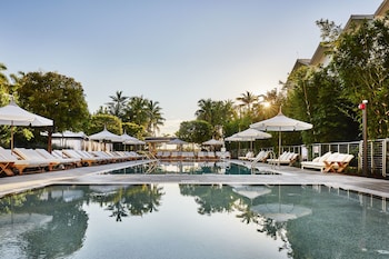 Outdoor pool, cabanas (surcharge), pool umbrellas at Nautilus Sonesta Miami Beach