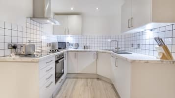 No2 (1 Bedroom Apartment - Ground Floor) | Private kitchen | Fridge, microwave, oven, stovetop