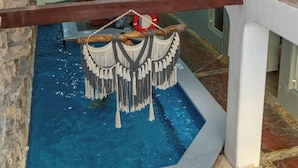 A multi-level interior with a pool area, seating, and a sign stating 'This is my happy place.' - Hotel Maria Candelaria (Playa del Carmen)